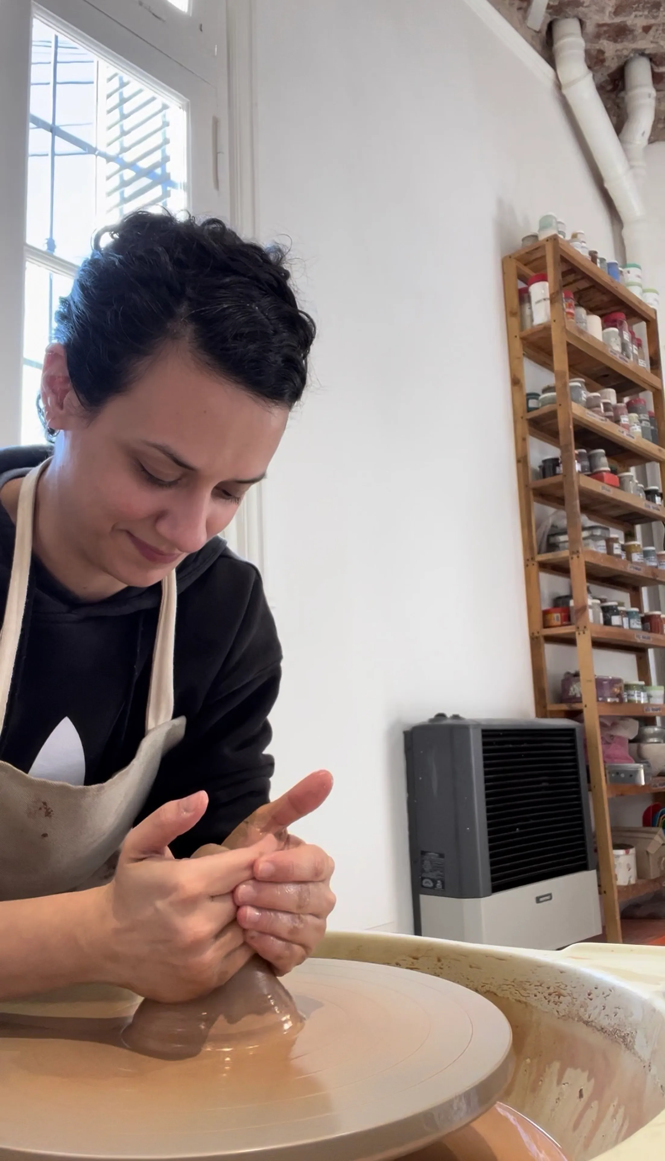 Lucía working at the ceramics studio